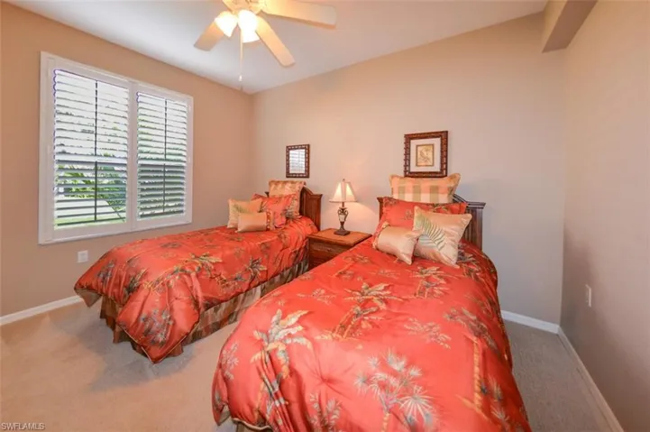 Bedroom with carpet and a ceiling fan