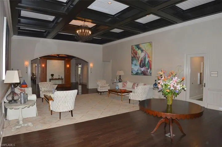 Lobby featuring ornamental molding, beam ceiling, and coffered ceiling