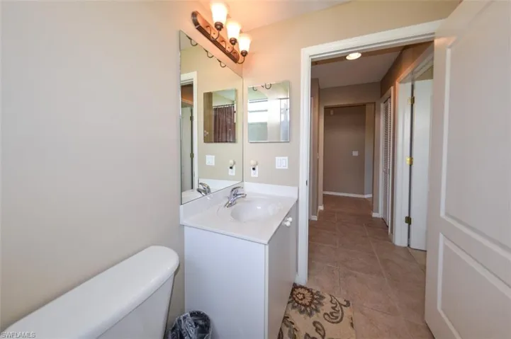Bathroom featuring vanity and light tile patterned flooring