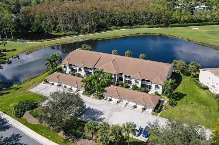 Drone / aerial view of a large body of water and a local golf course