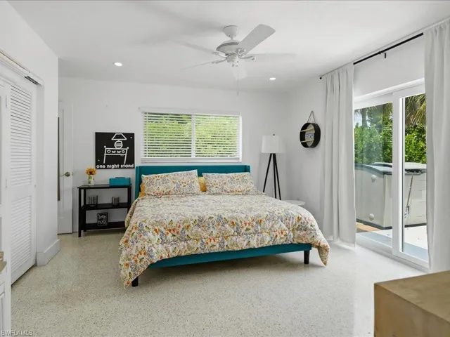 Bright interior space featuring white walls and light-colored terrazzo-style flooring