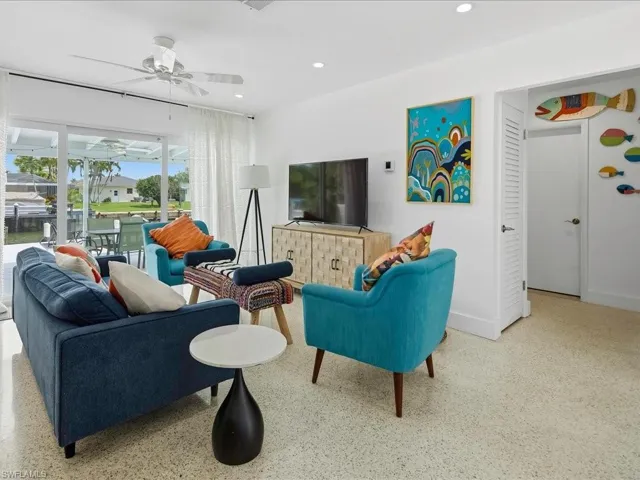 Living area featuring terrazzo flooring, recessed lighting, and a ceiling fan