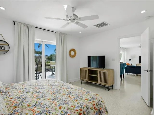 Bright interior featuring a ceiling fan, recessed lighting, and light-tone flooring