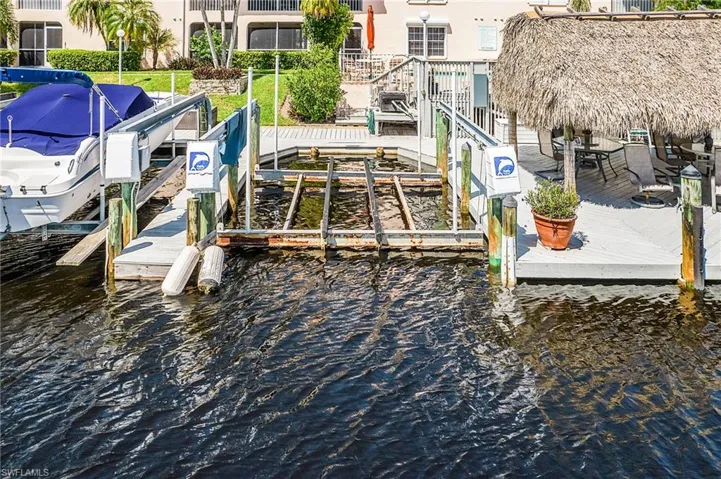 Dock with boat lift and a water view