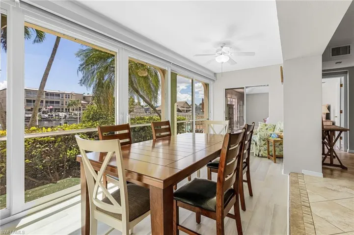 Dining area featuring a ceiling fan and light wood-style flooring