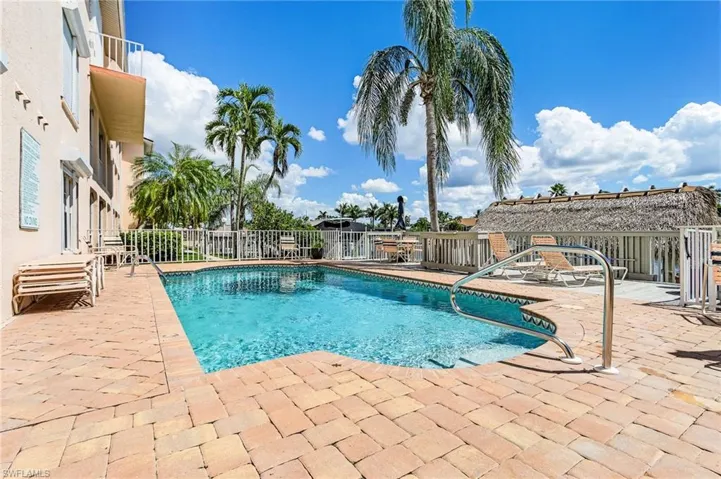 Community pool featuring a patio area