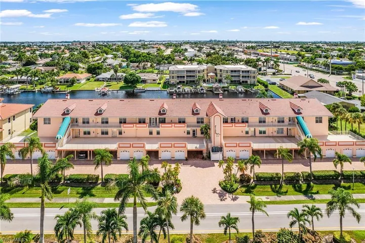 Aerial view of residential area featuring a large body of water