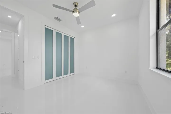 Unfurnished room with recessed lighting and a ceiling fan