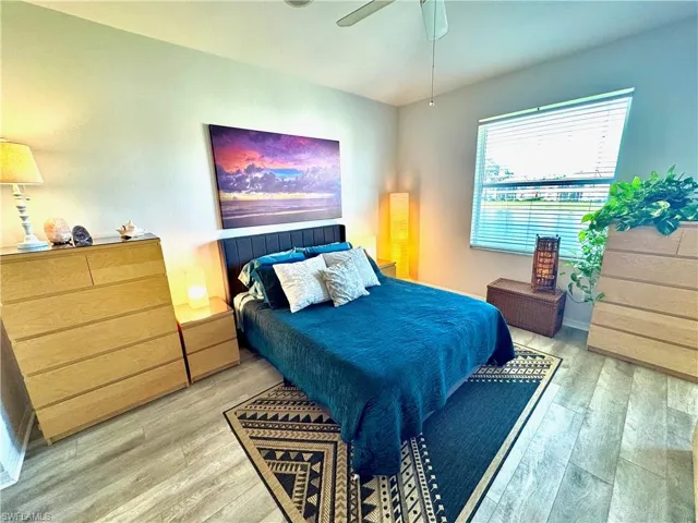 Bedroom featuring ceiling fan and light wood-type flooring