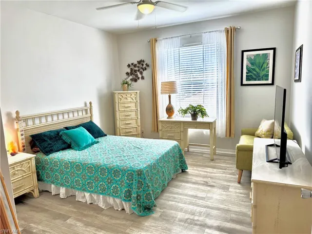 Bedroom featuring light hardwood / wood-style floors and ceiling fan