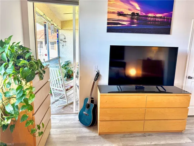 Living room with light hardwood / wood-style flooring