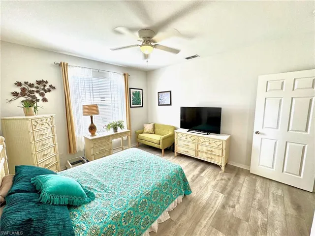 Bedroom featuring ceiling fan and light wood-type flooring