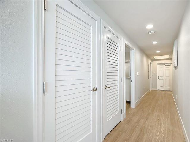 Other view of hallway and laundry closet