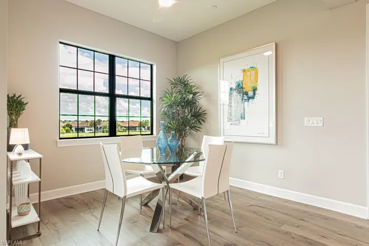 Dining room featuring wood finished floors and a ceiling fan