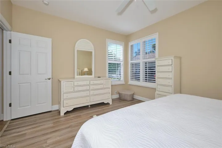 Bedroom with ceiling fan and wood finished floors