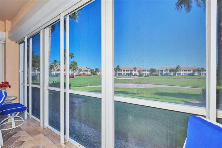 Unfurnished sunroom with golf course view