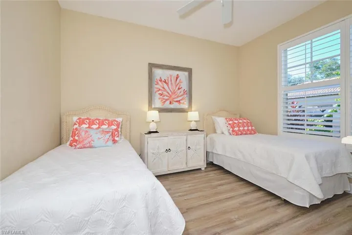 Bedroom with wood finished floors and a ceiling fan