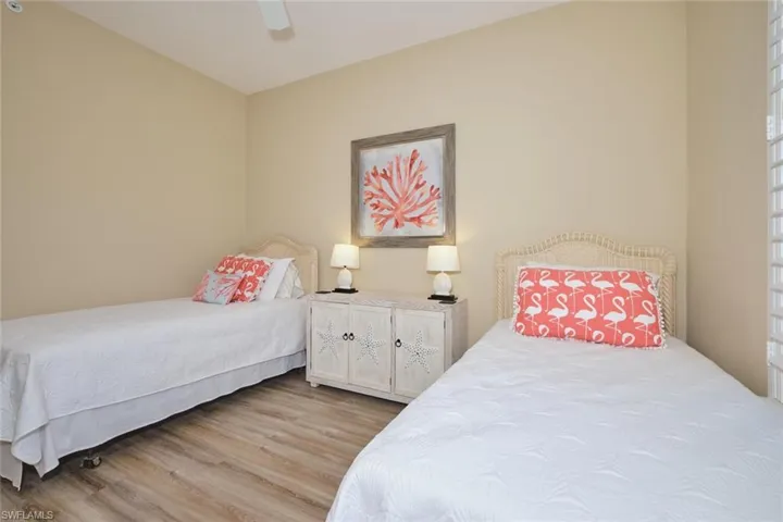 Bedroom with wood finished floors and a ceiling fan