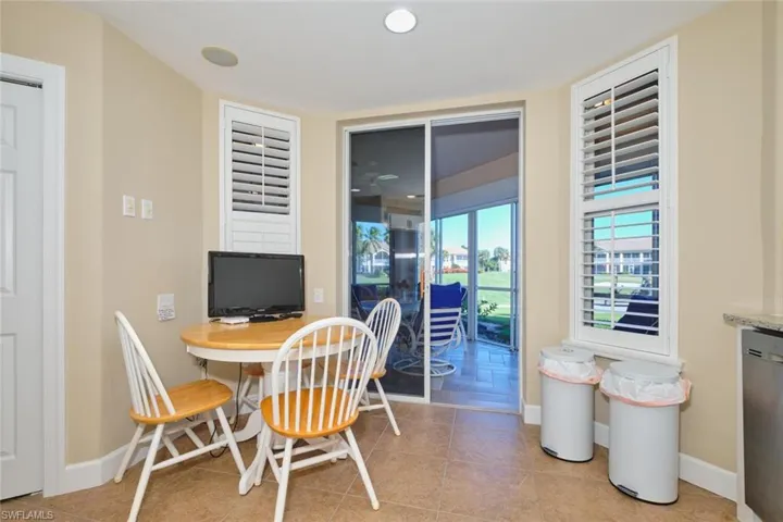 Dining area featuring light tile patterned floors and recessed lighting