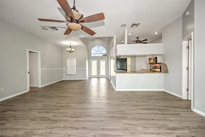 Living room with high vaulted ceiling