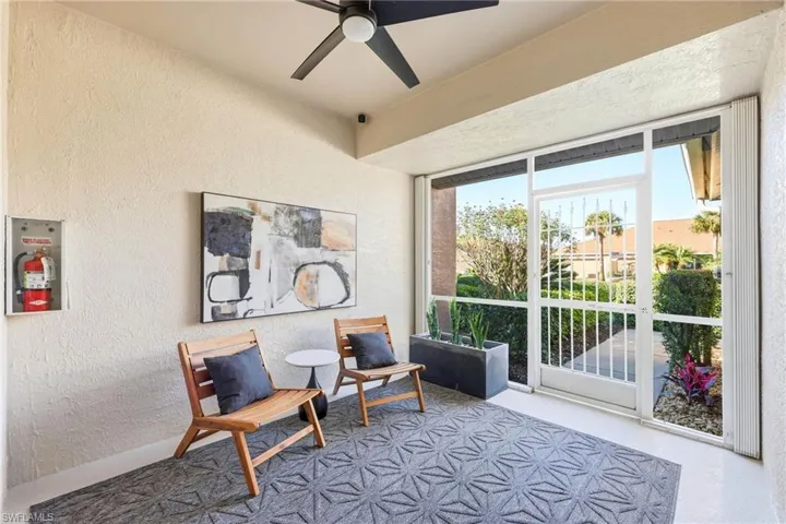 Spacious front lanai with fresh netural paint, modern ceiling fan that offers a welcoming entry. All windows and doors have hurrican shutters.
