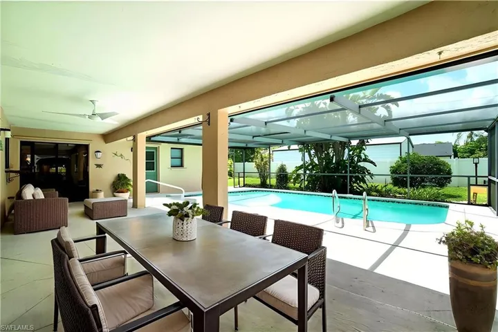 Patio set with table and sitting area are virtually staged.