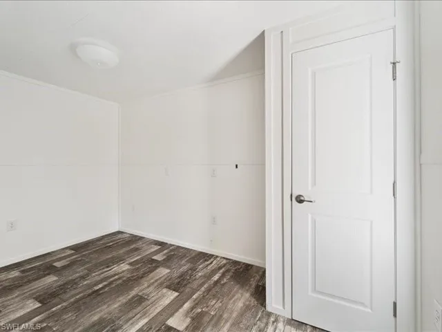 Unfurnished room with wood finished floors
