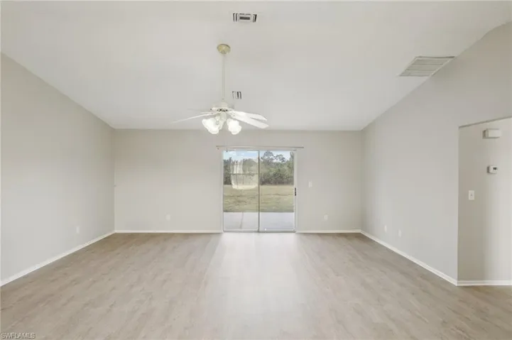 Empty room featuring light wood-style flooring and baseboards