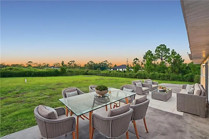 View of patio with an outdoor hangout area and outdoor dining area
