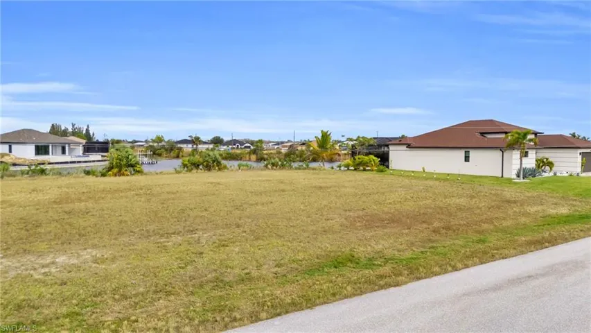 View of yard with a water view