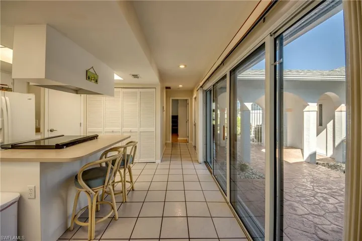 Hallway to guest quarters.  Sliders to courtyard make a great entertainment area.