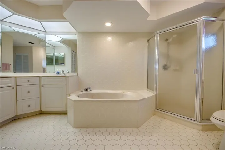 Dual sinks, spa garden tub, separate shower, new commode.