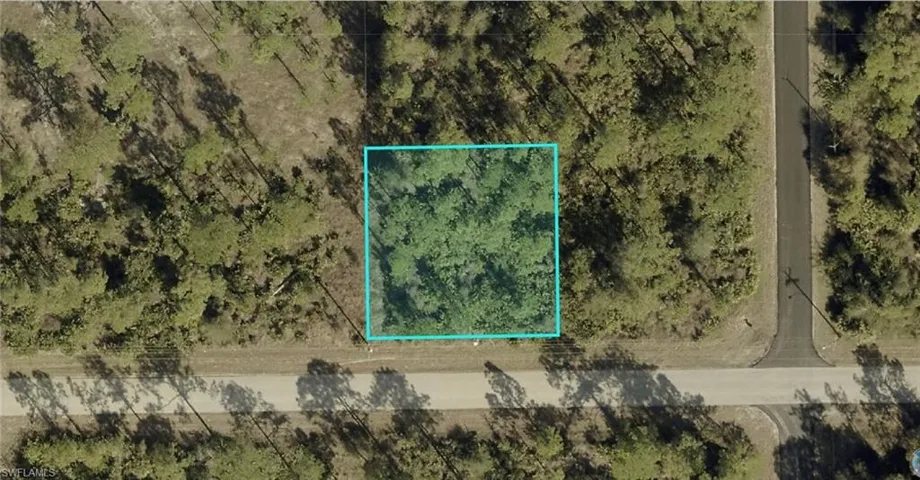 Aerial map of property and surrounding area featuring property parcel outlined