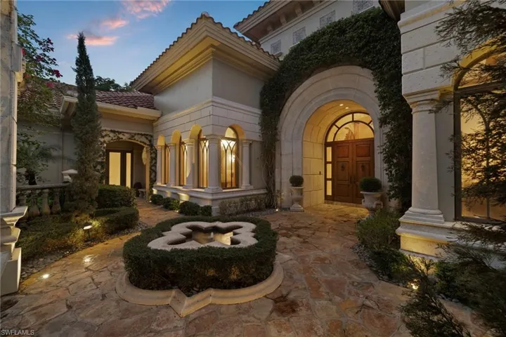 View of exterior entry at dusk