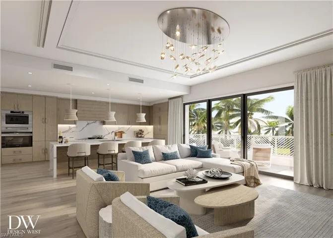Living room featuring light wood finished floors, a chandelier, and recessed lighting