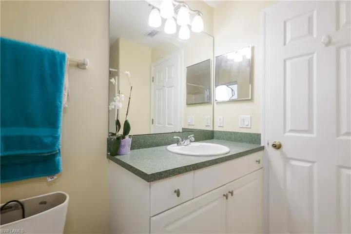 Bathroom featuring vanity and a freestanding bath