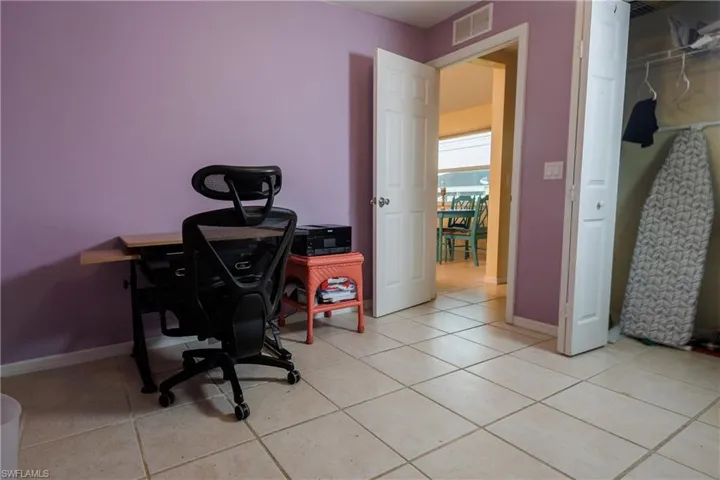 Office featuring baseboards and light tile patterned floors