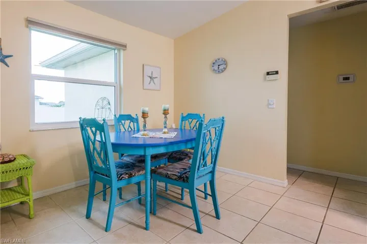 Dining space featuring light tile patterned flooring