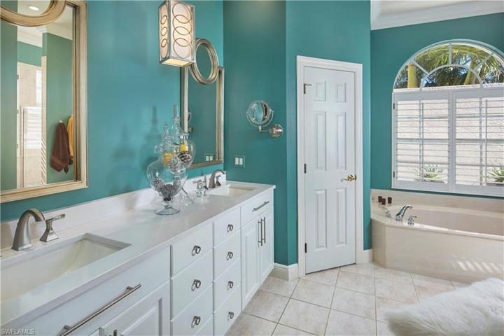 Updated primary bathroom with soaking tub and large walk in shower.