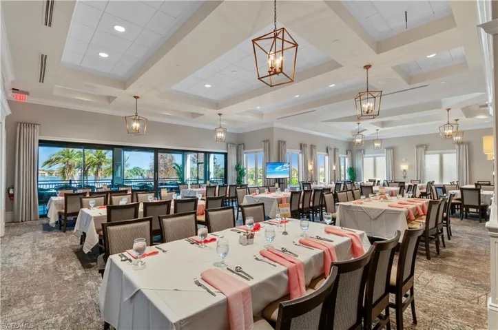 Dining room with crown molding, coffered ceiling, and beamed ceiling