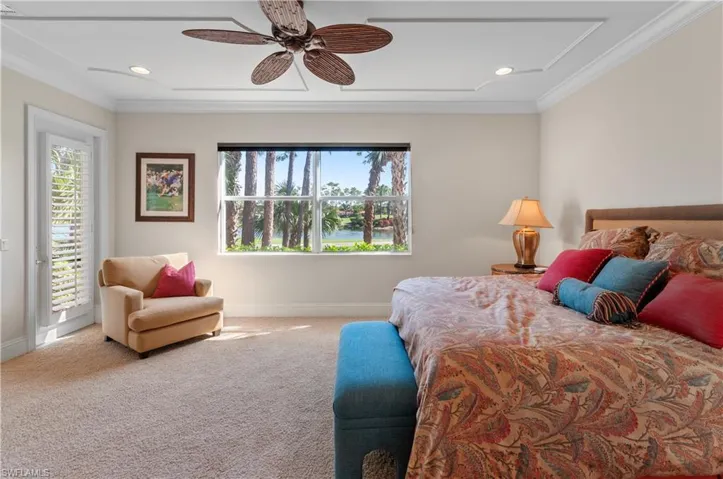 Bedroom with ornamental molding, carpet flooring, access to outside, and ceiling fan