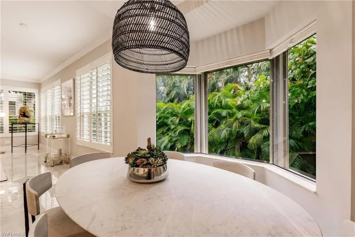 Dining space featuring crown molding