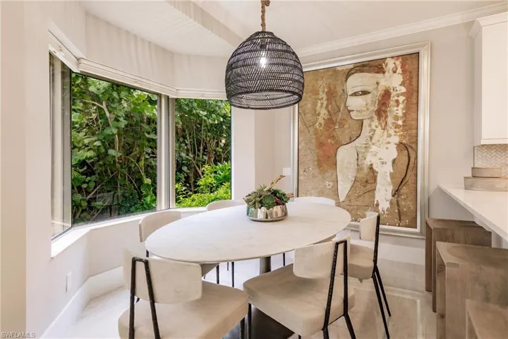 Dining area featuring ornamental molding