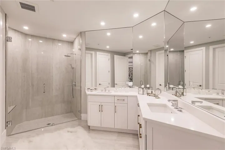 Bathroom with an enclosed shower and vanity
