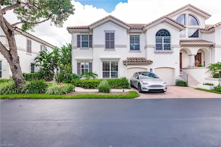 Mediterranean / spanish-style home featuring a garage