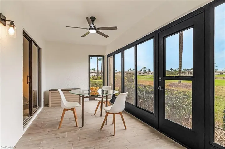 Sunroom / solarium with french doors and wood finished floors