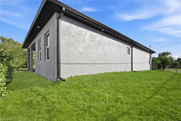 View of property exterior with stucco siding