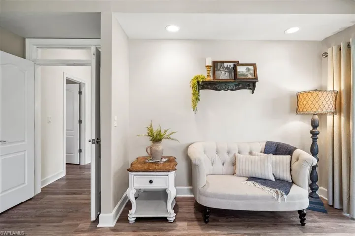 Sitting room with recessed lighting, wood finished floors, and baseboards