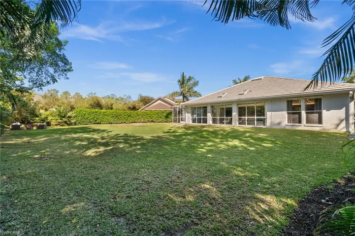 View of yard featuring a sunroom