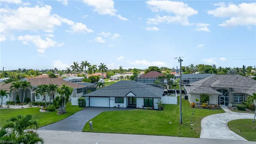 View of front of home with a two car garage.